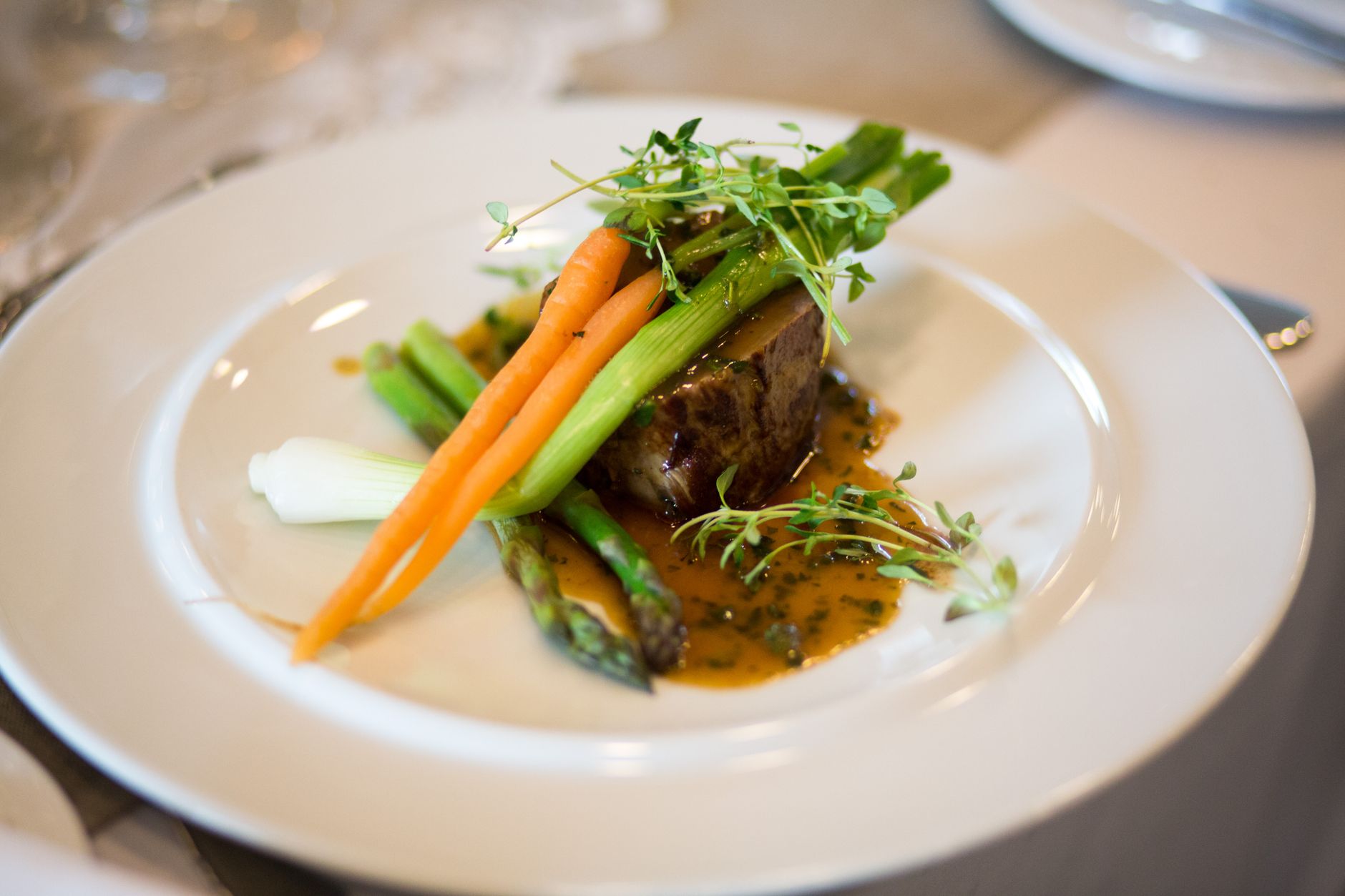 A plated main course from the Harvest & Rye kitchen